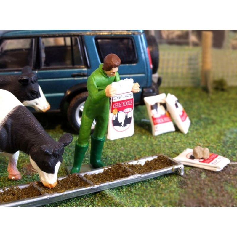 HLT-WM078G Man Emptying Stock Feed Sack with Empty Sacks